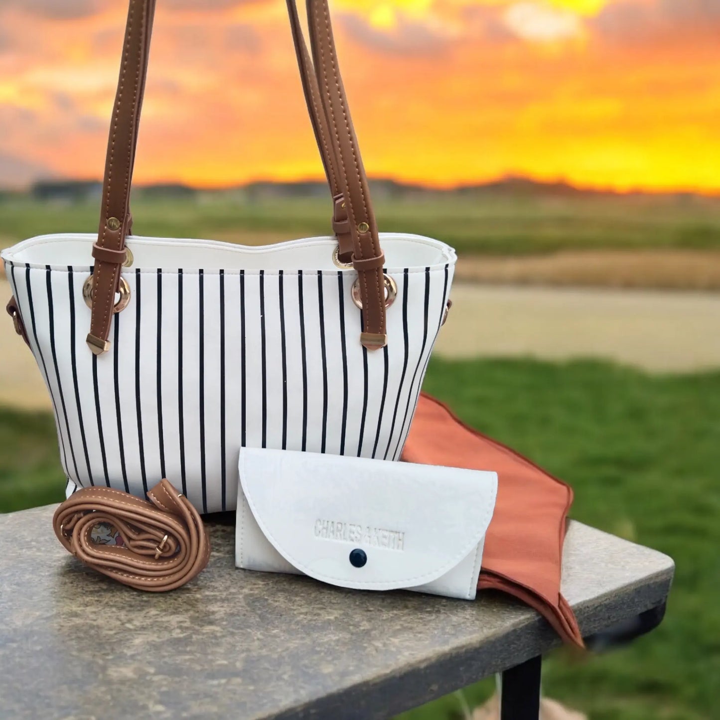 Elegant White Handbag with Black Stripes & Multi-Use Pouch