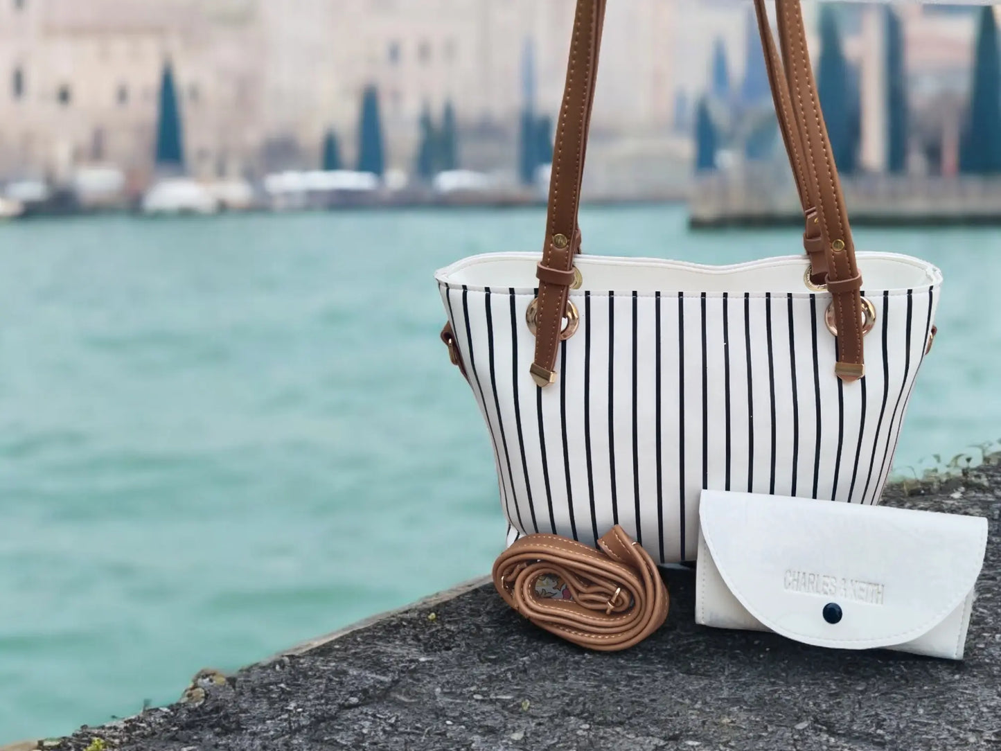 Elegant White Handbag with Black Stripes & Multi-Use Pouch